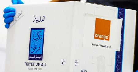 Orange Jordan distributes Iftar meals and food parcels with Tkiyet Um Ali