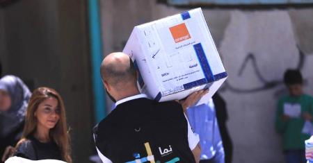 Orange Jordan employees participate in the distribution of food parcels to underprivileged families